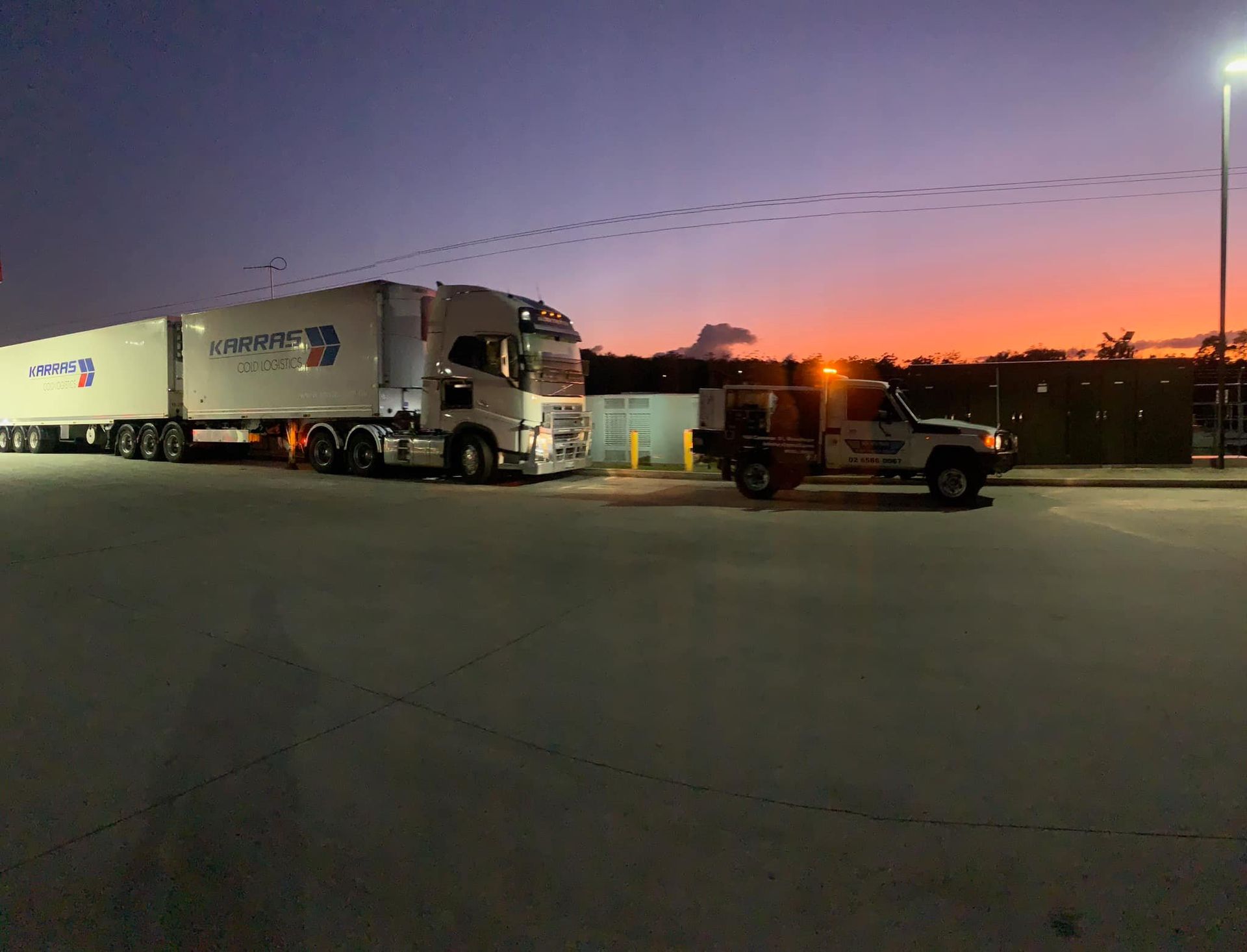 A Truck is Parked in a Parking Lot With a Sunset in the Background — BDM Heavy Vehicle Repairs In Port Macquarie, NSW