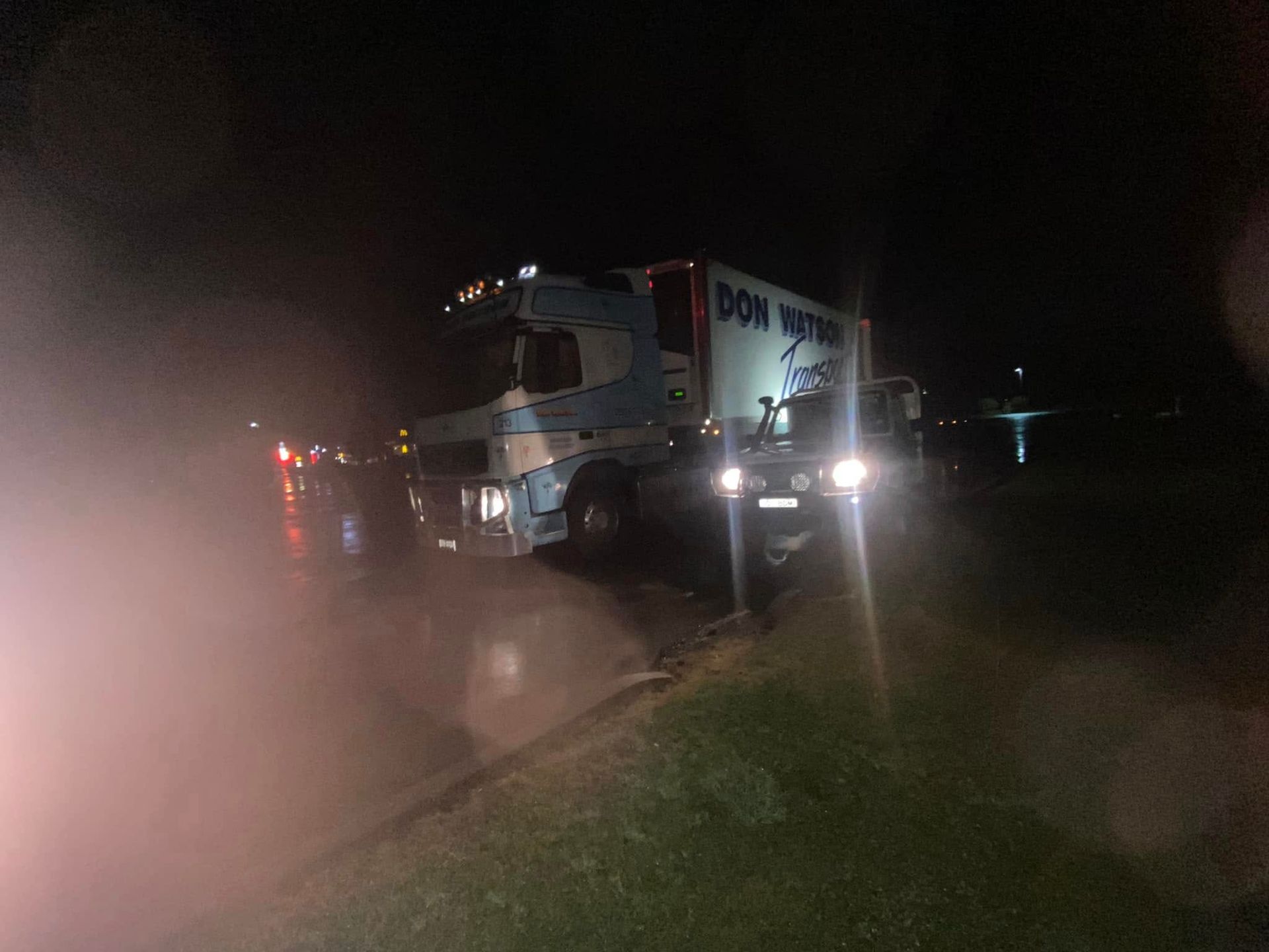 A Truck is on the Side of the Road at Night With Smoke Coming Out of It — BDM Heavy Vehicle Repairs In Wauchope, NSW