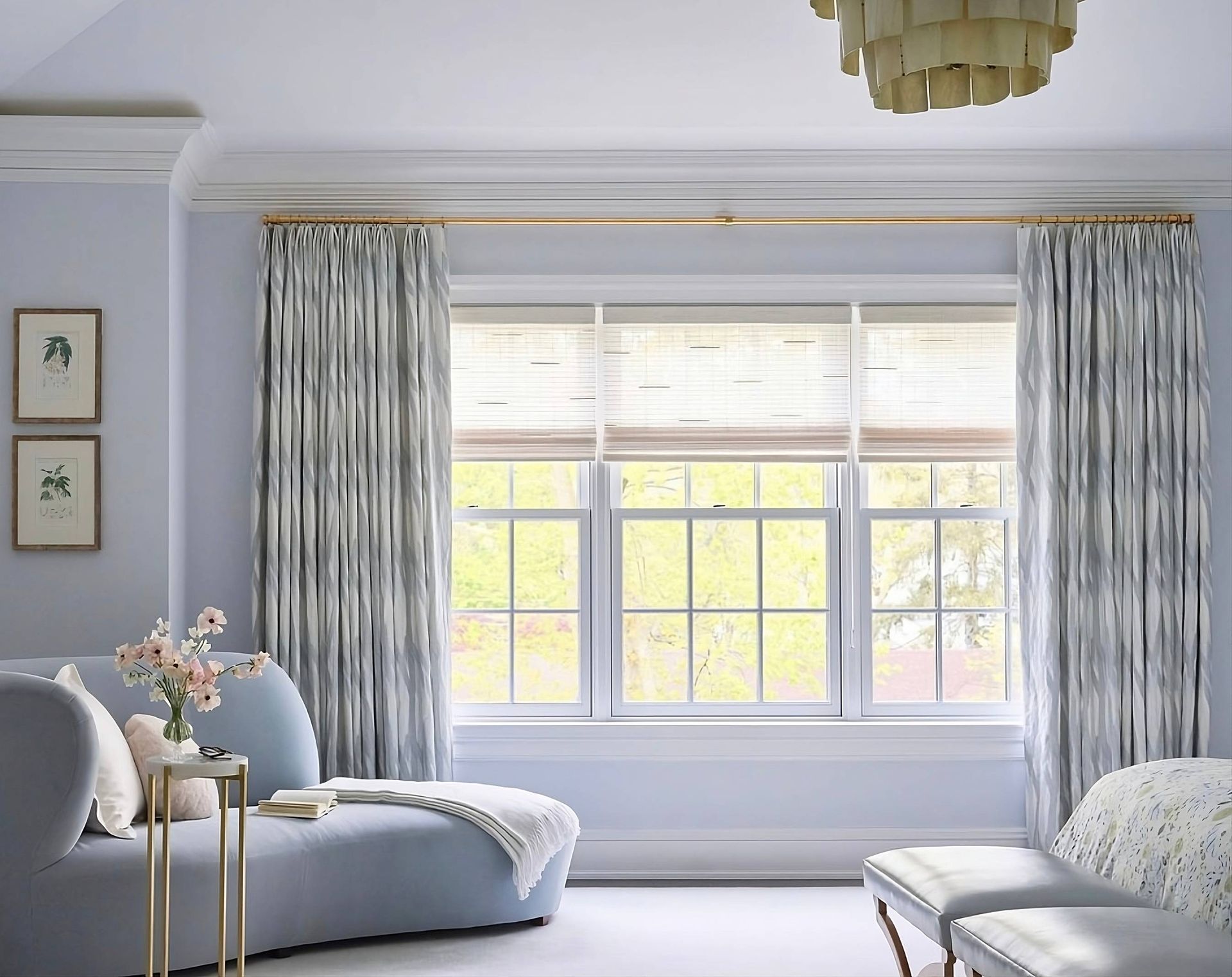 Custom window treatments from Hunter Douglas on windows in a light blue living room near Houston, TX