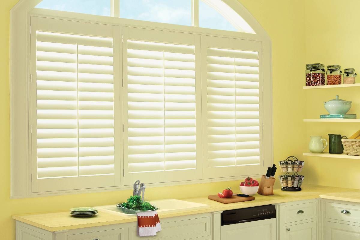 Hunter Douglas shutters adorning a kitchen sink window near Houston, TX