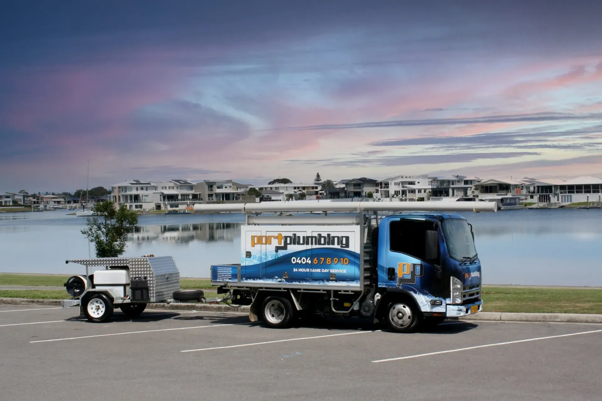 A Pert Plumbing Truck With a Small Trailer — Port Macquarie Plumbing In Port Macquarie, NSW