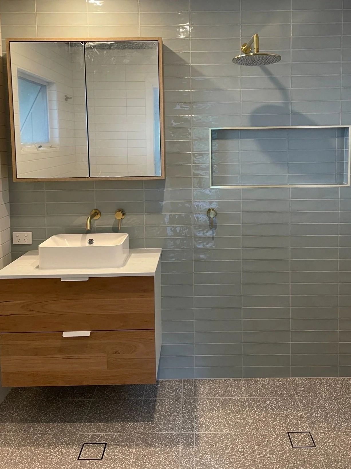 A Modern Bathroom With a Wood Vanity and a Recessed Niche — Port Macquarie Plumbing In Port Macquarie, NSW