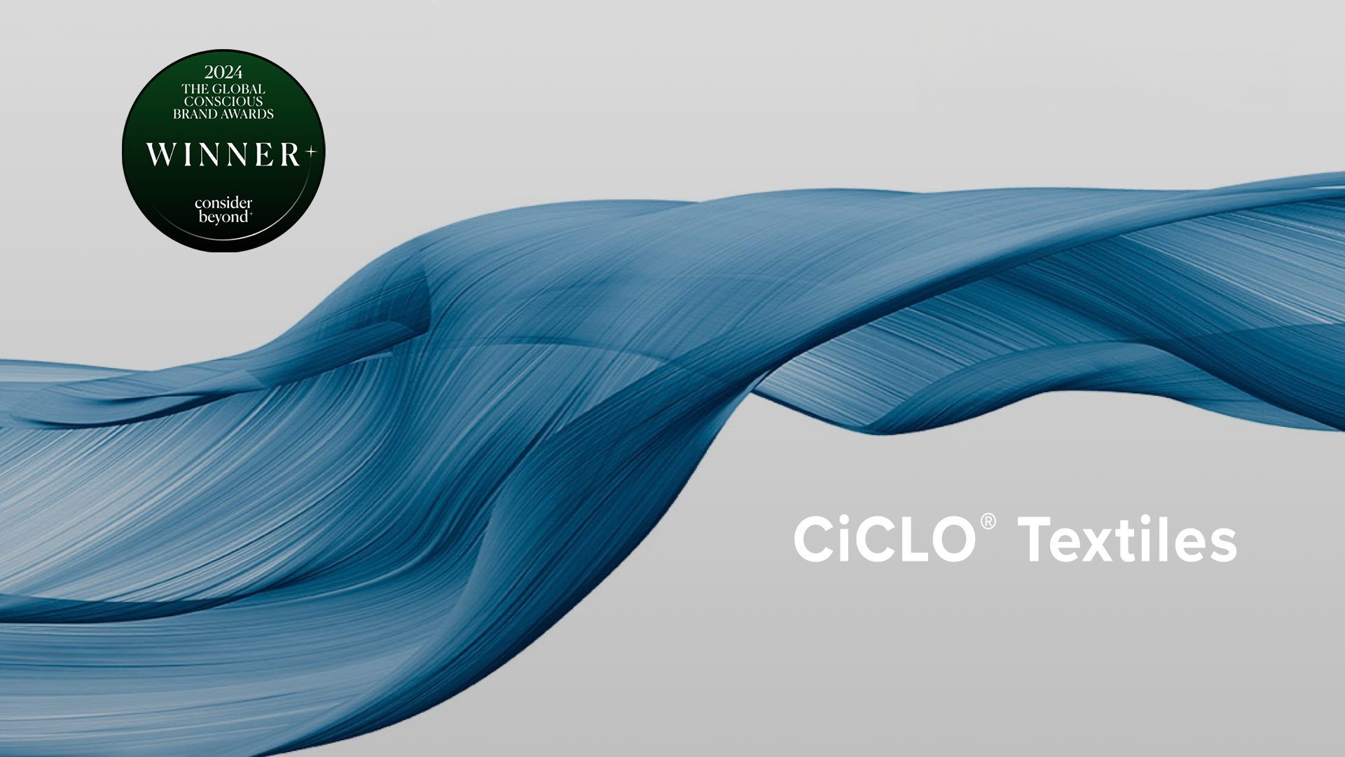 A blue wave with the words ciclo textiles on it