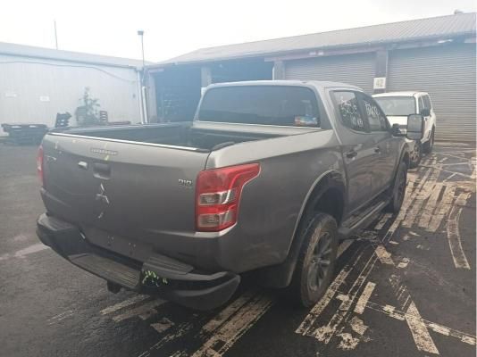 Gray Mitsubishi Pickup Truck Parked Near Buildings  — South West 4WD Wreckers In Brisbane, QLD