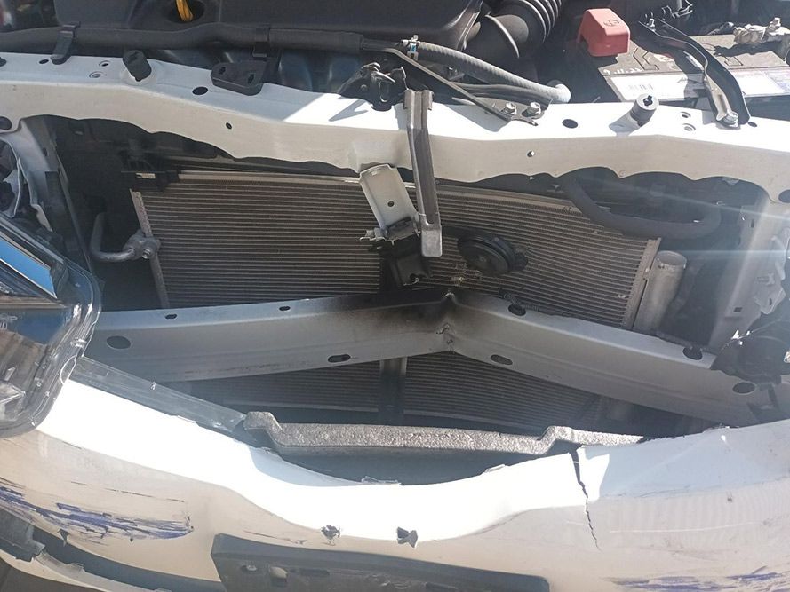 A White Car with the Hood Open and the Radiator Visible — South West 4WD Wreckers In Brisbane, QLD