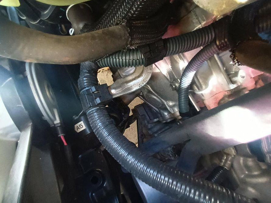 A Close Up of a Car Engine with Hose Attached to It — South West 4WD Wreckers In Brisbane, QLD
