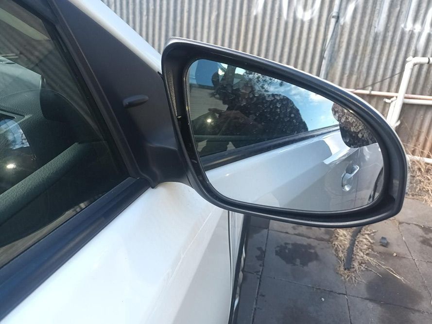 A Close Up of a Side View Mirror on a White Car — South West 4WD Wreckers In Brisbane, QLD