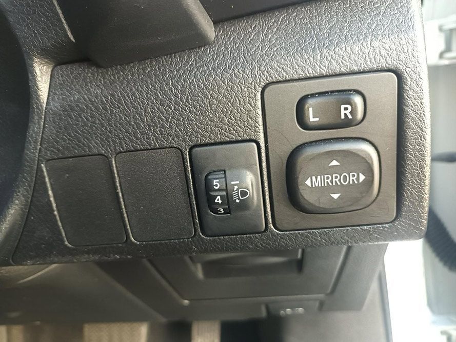 A Close Up of a Car Dashboard with a Mirror Switch — South West 4WD Wreckers In Brisbane, QLD