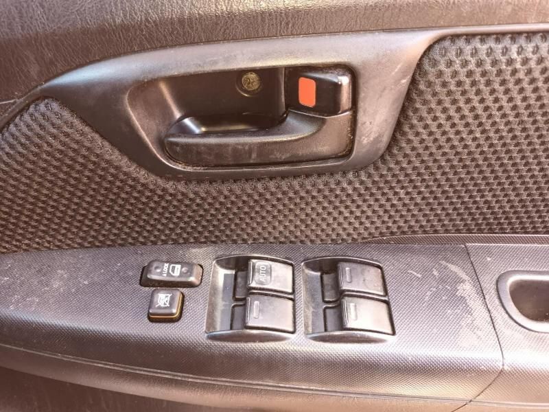 A Close Up of a Car Door With a Window Switch — South West 4WD Wreckers In Brisbane, QLD