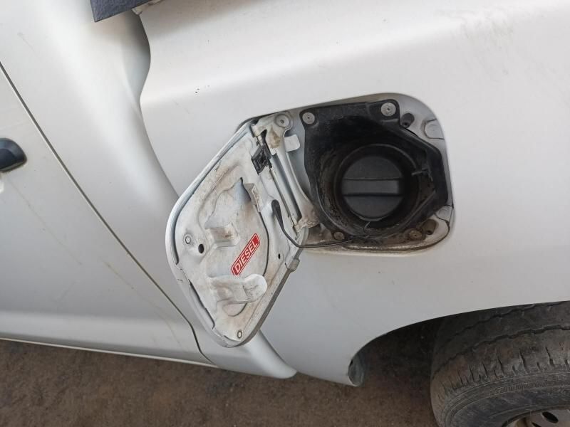A Close Up of a White Car With the Fuel Tank Open — South West 4WD Wreckers In Brisbane, QLD