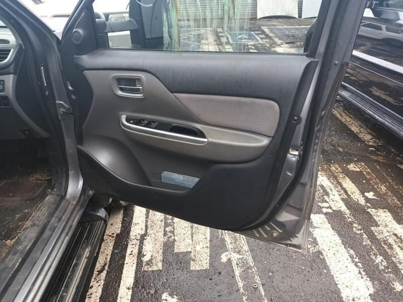 A Car With the Door Open is Parked in a Parking Lot — South West 4WD Wreckers In Brisbane, QLD