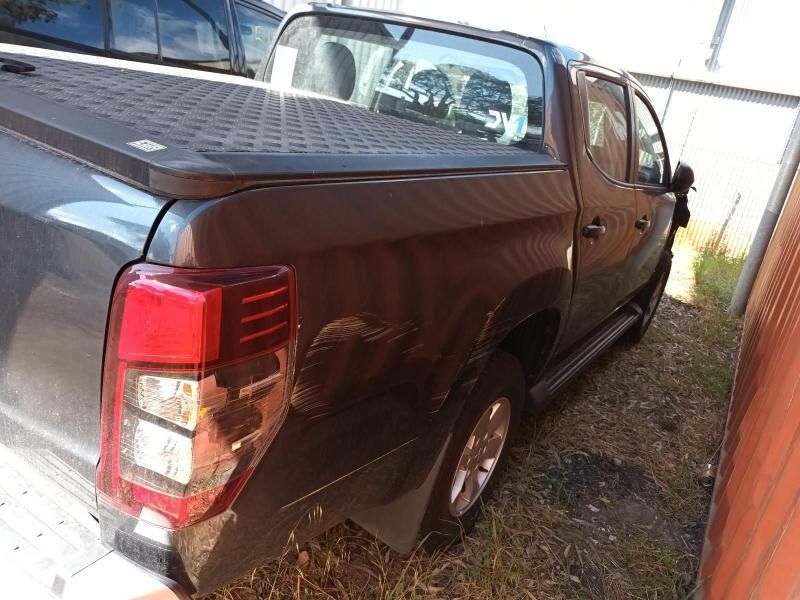 A Brown Pickup Truck is Parked in Front of a Building — South West 4WD Wreckers In Brisbane, QLD