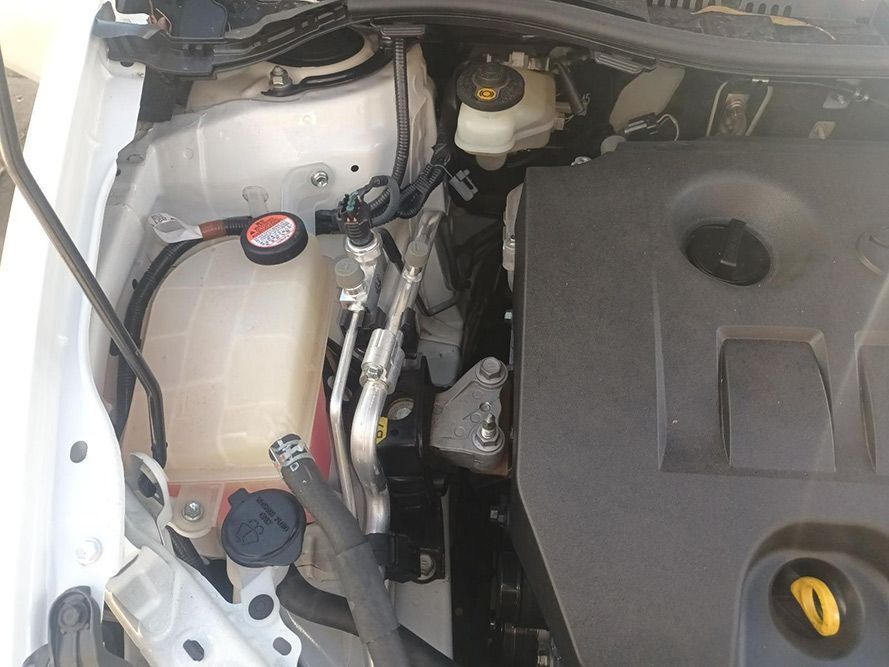 A Close Up of the Engine of a White Car — South West 4WD Wreckers In Brisbane, QLD