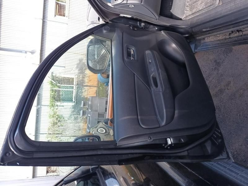 A Black Car With the Door Open and the Window Open — South West 4WD Wreckers In Brisbane, QLD