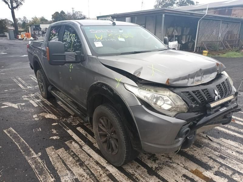 A Gray Truck With a Broken Hood is Parked in a Parking Lot — South West 4WD Wreckers In Brisbane, QLD