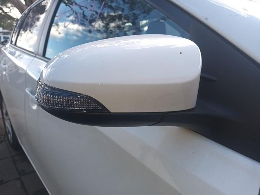 A Close Up of a Side View Mirror on a White Car — South West 4WD Wreckers In Brisbane, QLD