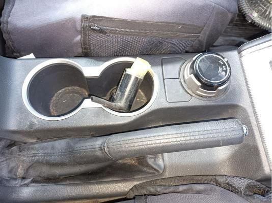 A Car Console With Two Cup Holders and a Handbrake — South West 4WD Wreckers In Brisbane, QLD