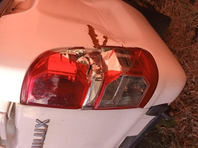 A White Hilux With a Damaged Tail Light — South West 4WD Wreckers In Brisbane, QLD