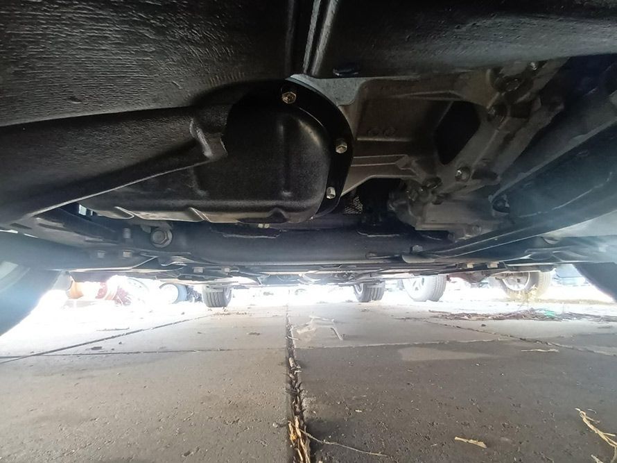 The Underside of a Car Parked on the Side of the Road — South West 4WD Wreckers In Brisbane, QLD