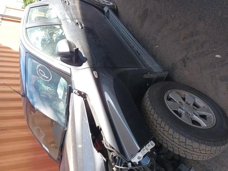 A Damaged Car is Parked on the Side of the Road — South West 4WD Wreckers In Brisbane, QLD