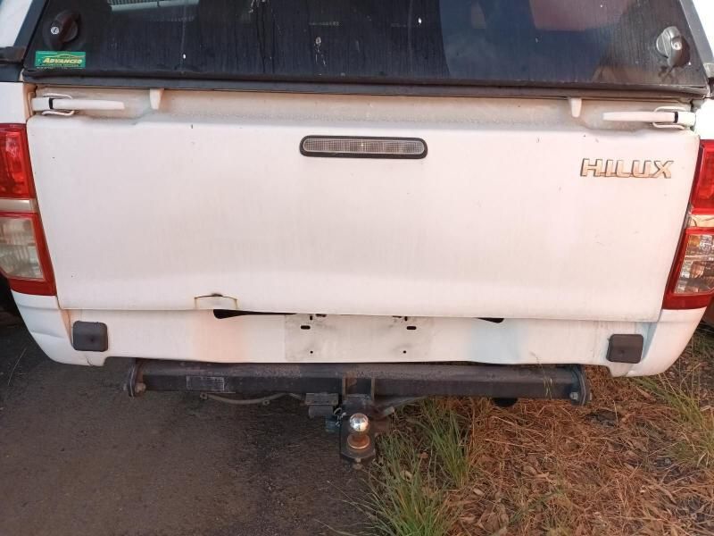 The Back End of a White Toyota Hilux Truck is Shown — South West 4WD Wreckers In Brisbane, QLD