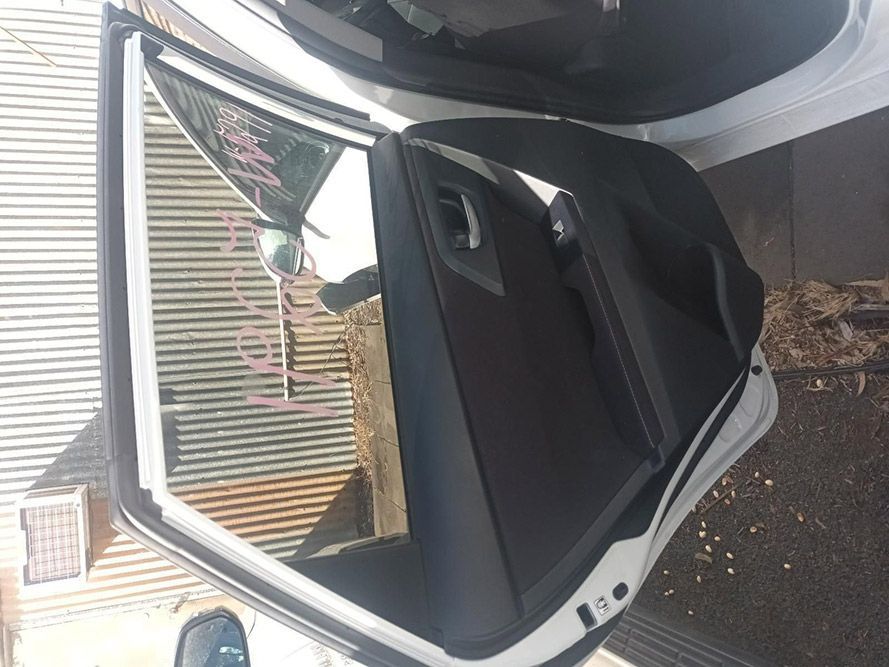 The Back Door of a White Car is Open — South West 4WD Wreckers In Brisbane, QLD