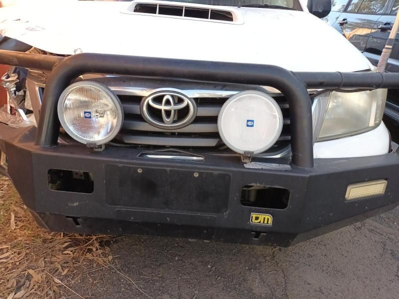A White Toyota With a Black Bumper and Lights — South West 4WD Wreckers In Brisbane, QLD