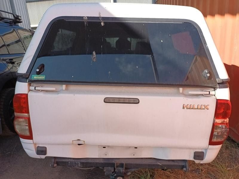 A White Hilux Truck With a Canopy on Top of It — South West 4WD Wreckers In Brisbane, QLD