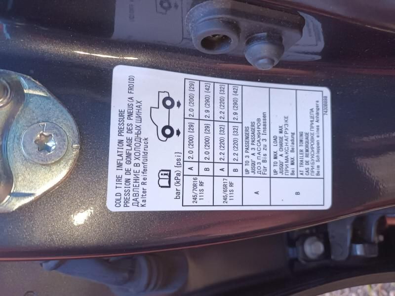 A Close Up of a Tire Pressure Label on a Car — South West 4WD Wreckers In Brisbane, QLD