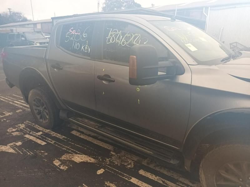 A Gray Truck is Parked on the Side of the Road — South West 4WD Wreckers In Brisbane, QLD