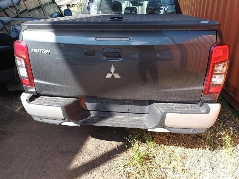 The Back End of a Mitsubishi Triton Truck is Shown — South West 4WD Wreckers In Brisbane, QLD