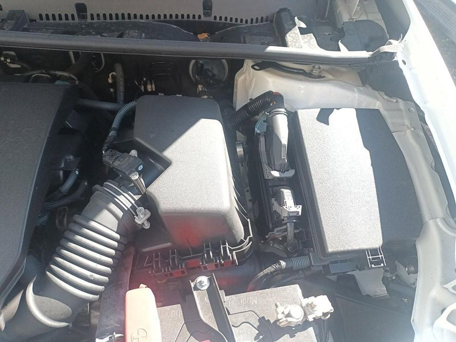 A Close Up of the Engine of a White Car — South West 4WD Wreckers In Brisbane, QLD 