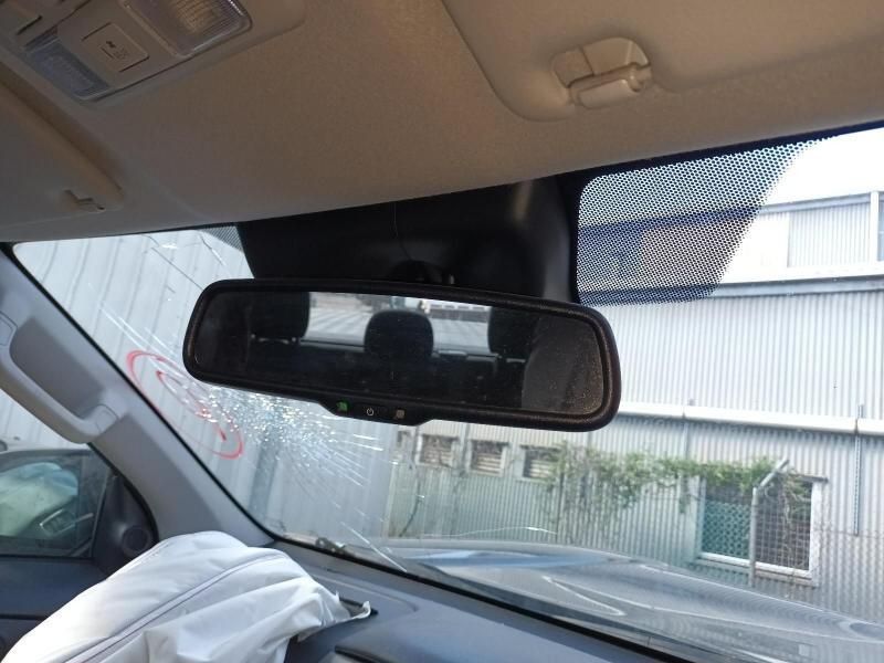 A Car With a Rear View Mirror is Parked in Front of a Building — South West 4WD Wreckers In Brisbane, QLD