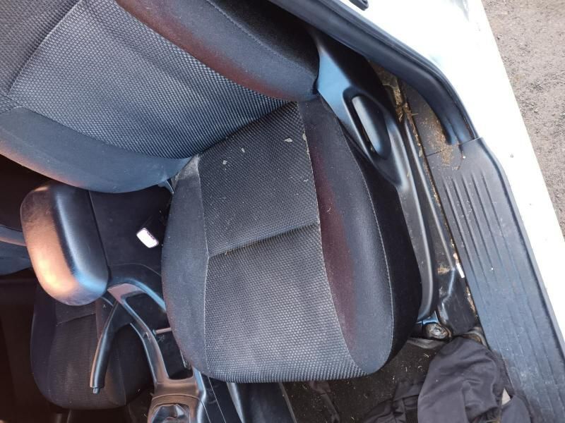 A White Car With a Black Seat and Arm Rest — South West 4WD Wreckers In Brisbane, QLD