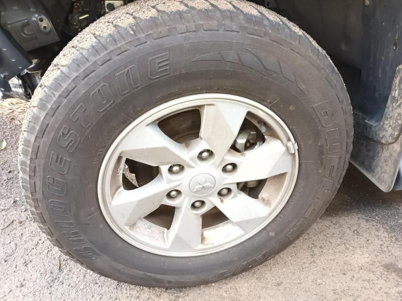 A Close Up of a Tire on a Car That Says Bridgestone — South West 4WD Wreckers In Brisbane, QLD