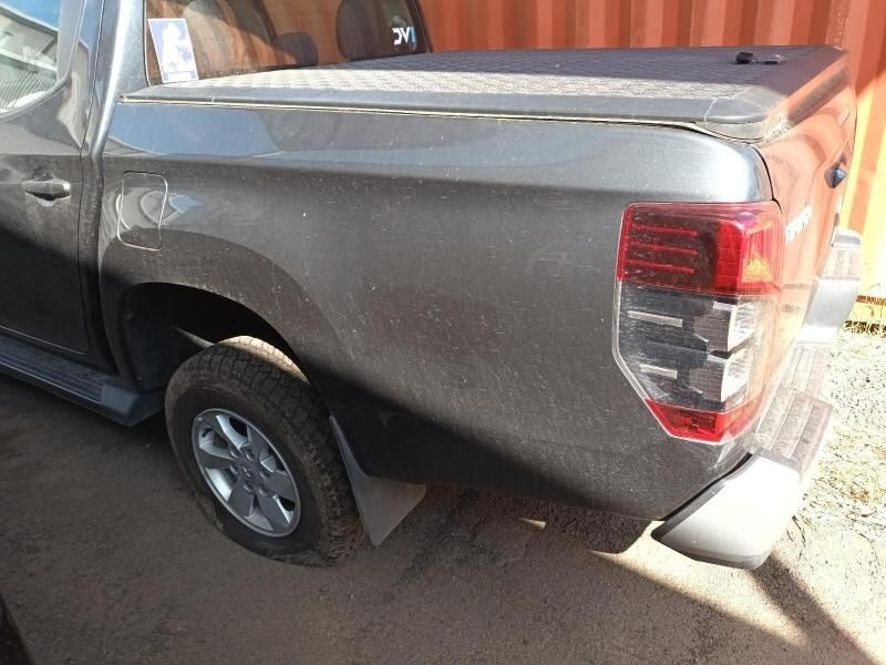 A Gray Truck is Parked in Front of an Orange Container — South West 4WD Wreckers In Brisbane, QLD