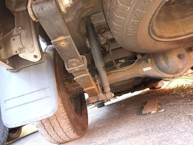 A Close Up of the Underside of a Car With a Tire on the Ground — South West 4WD Wreckers In Brisbane, QLD