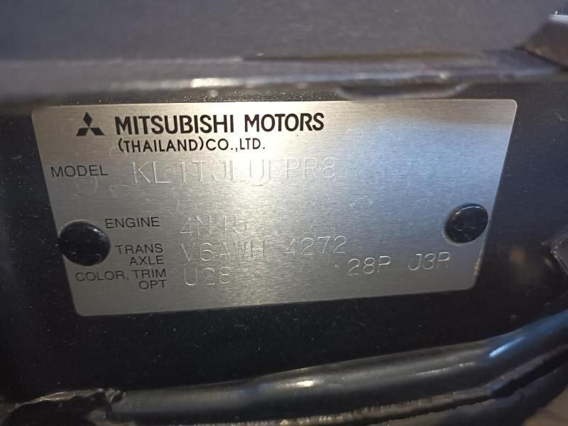 A Close Up of a Mitsubishi Motors Label on a Car — South West 4WD Wreckers In Brisbane, QLD