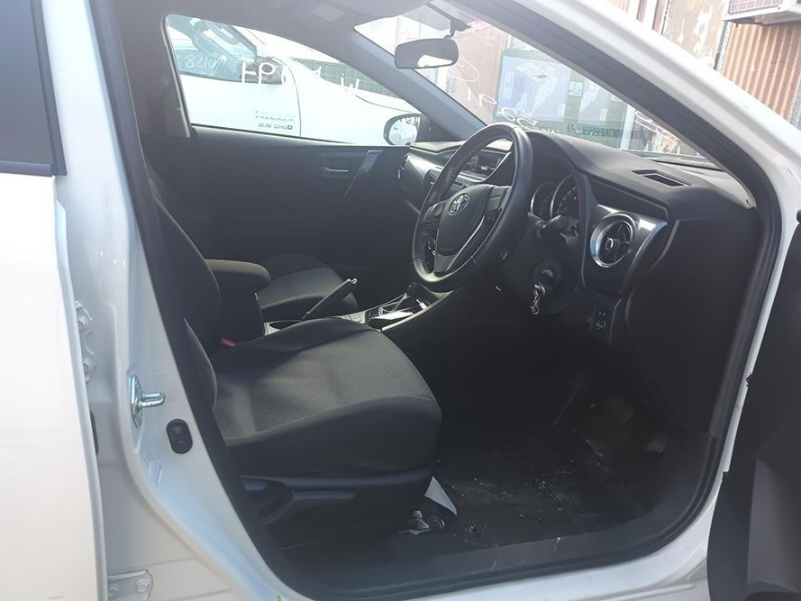 The Inside of a White Car with the Door Open — South West 4WD Wreckers In Brisbane, QLD