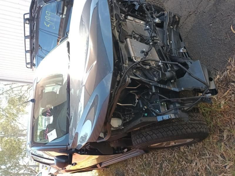 A Damaged Car is Sitting on the Side of the Road — South West 4WD Wreckers In Brisbane, QLD