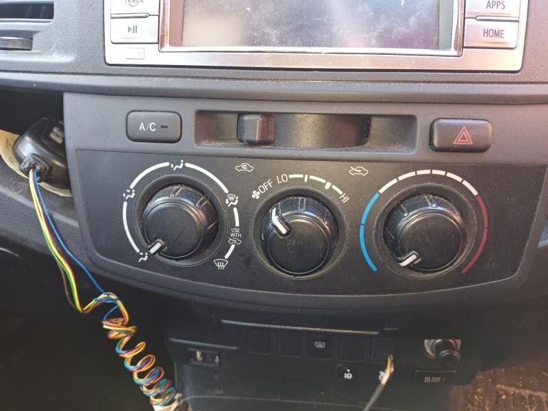 A Close Up of a Cars Dashboard With a Telephone Cord Attached to It — South West 4WD Wreckers In Brisbane, QLD