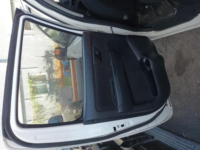 The Back Door of a White Car is Open — South West 4WD Wreckers In Brisbane, QLD