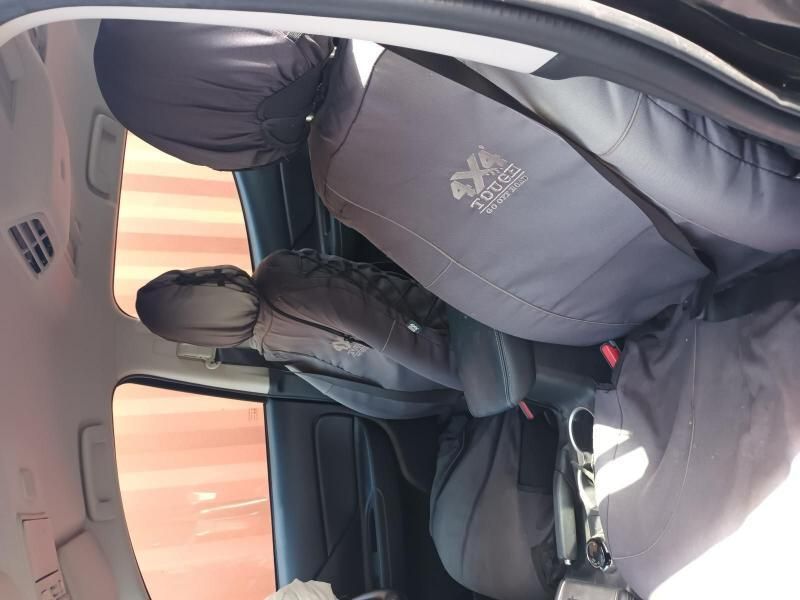 A Person is Sitting in the Back Seat of a Car — South West 4WD Wreckers In Brisbane, QLD