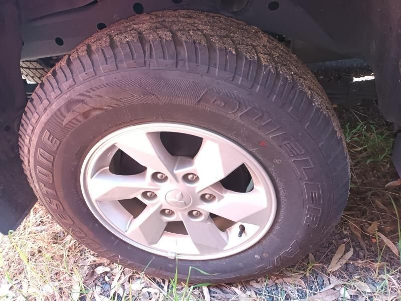 A Close Up of a Tire on a Car on the Ground — South West 4WD Wreckers In Brisbane, QLD