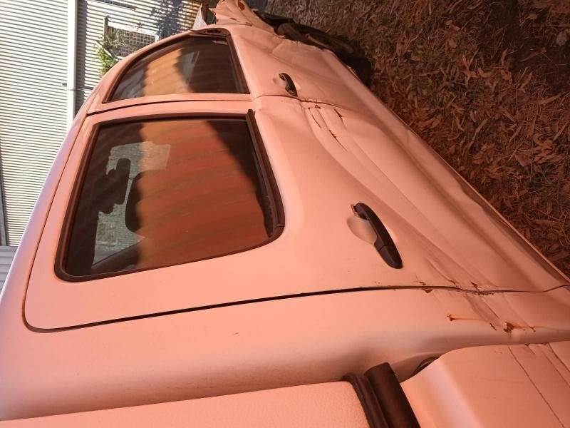 A White Truck is Parked on the Ground With the Door Open — South West 4WD Wreckers In Brisbane, QLD