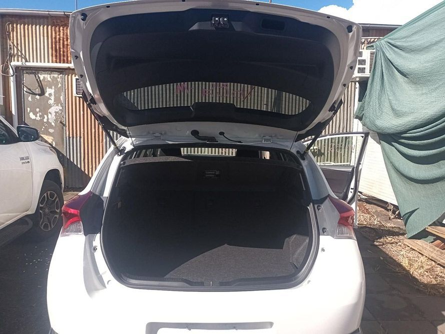 The Back of a White Car with the Trunk Open — South West 4WD Wreckers In Brisbane, QLD