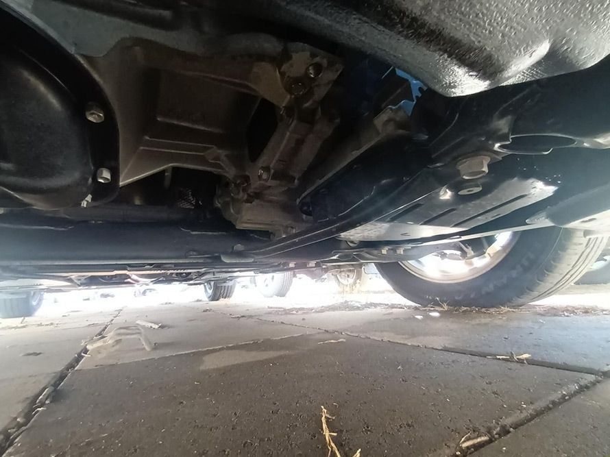 A Close Up of the Underside of a Car Parked on a Sidewalk — South West 4WD Wreckers In Brisbane, QLD
