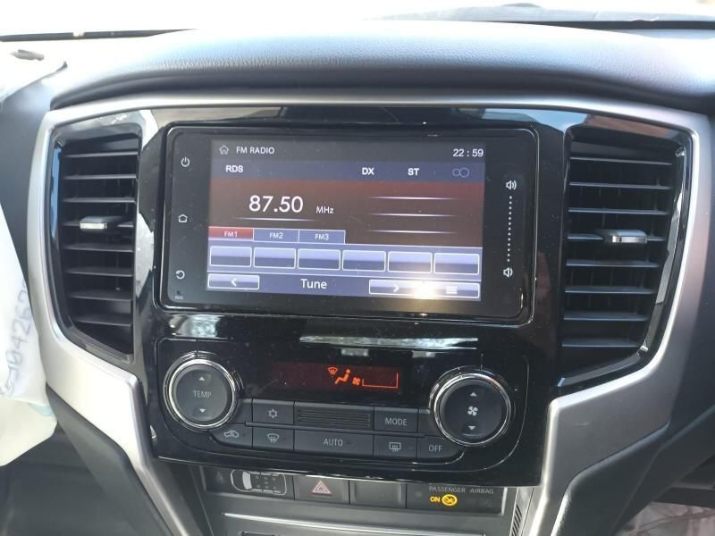 A Car Dashboard With a Radio That Says 87.50 on It — South West 4WD Wreckers In Brisbane, QLD