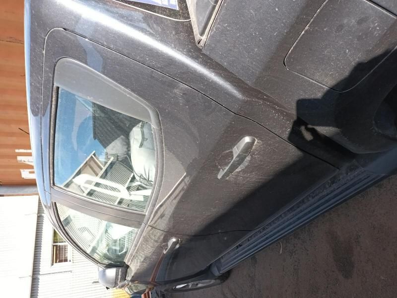 A Black Car is Parked on the Side of the Road — South West 4WD Wreckers In Brisbane, QLD