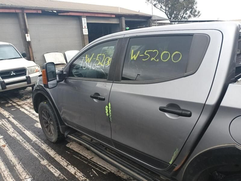 A Gray Truck is Parked in Front of a Garage With the Door Open — South West 4WD Wreckers In Brisbane, QLD